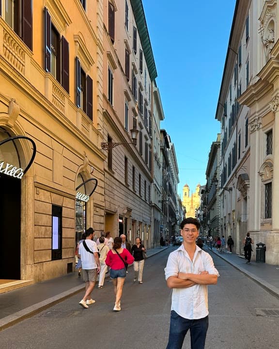 Braxton Mondell standing in a street in Rome