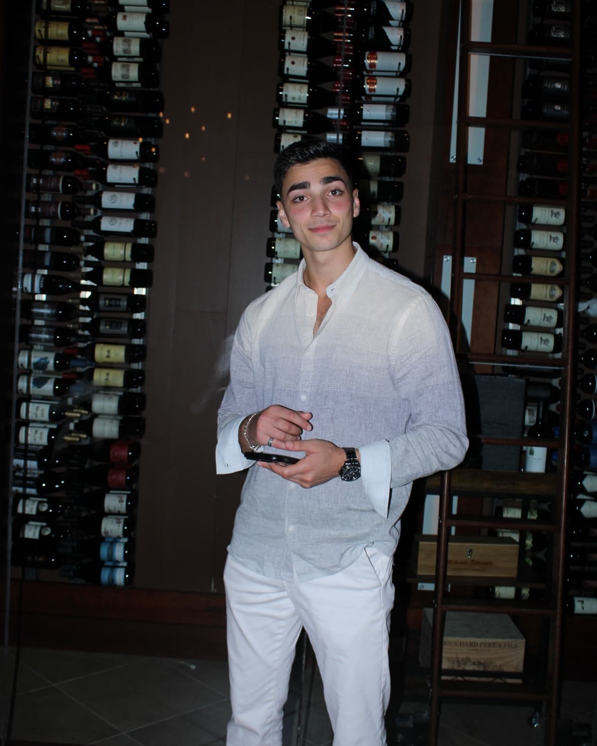 Zaid Alsalhani at dinner in a wine cellar restaurant